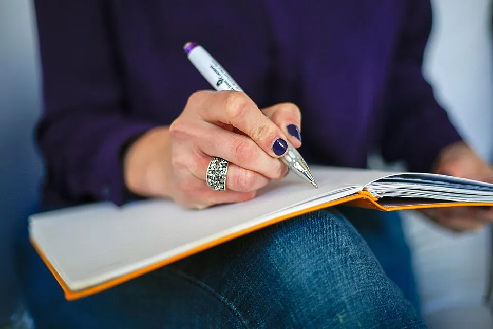 Person writing in a notebook